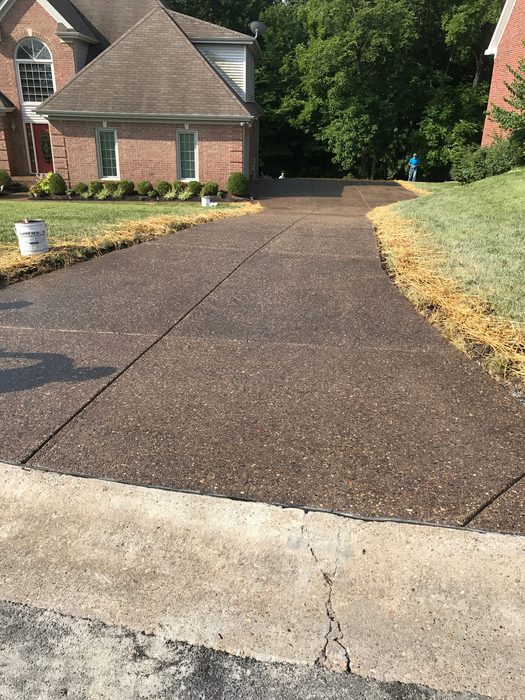 Exposed aggregate concrete driveway after sealing