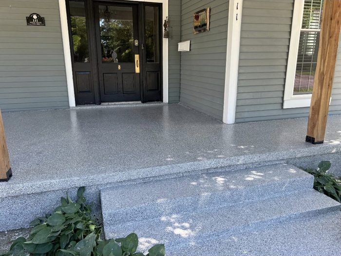 Front porch and steps finished with a gray flake coating