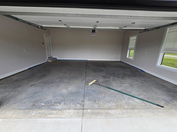 Bare garage floor prepped for an epoxy flake coating